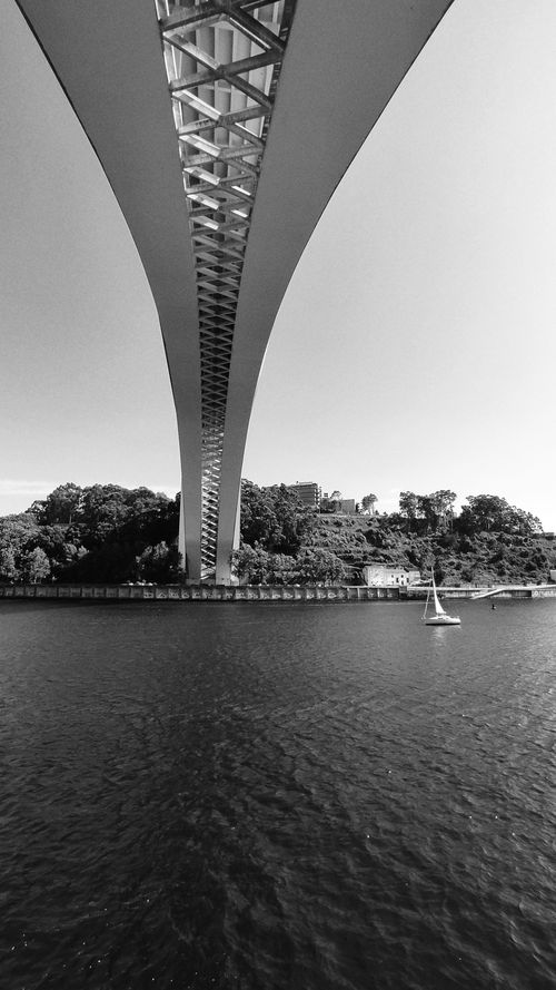 Free Black and white shot of Arrábida Bridge in Porto, Portugal, with a stunning vertical view. Stock Photo