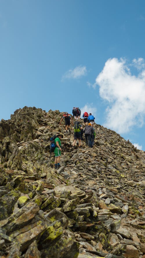 People on a Rocky Hill