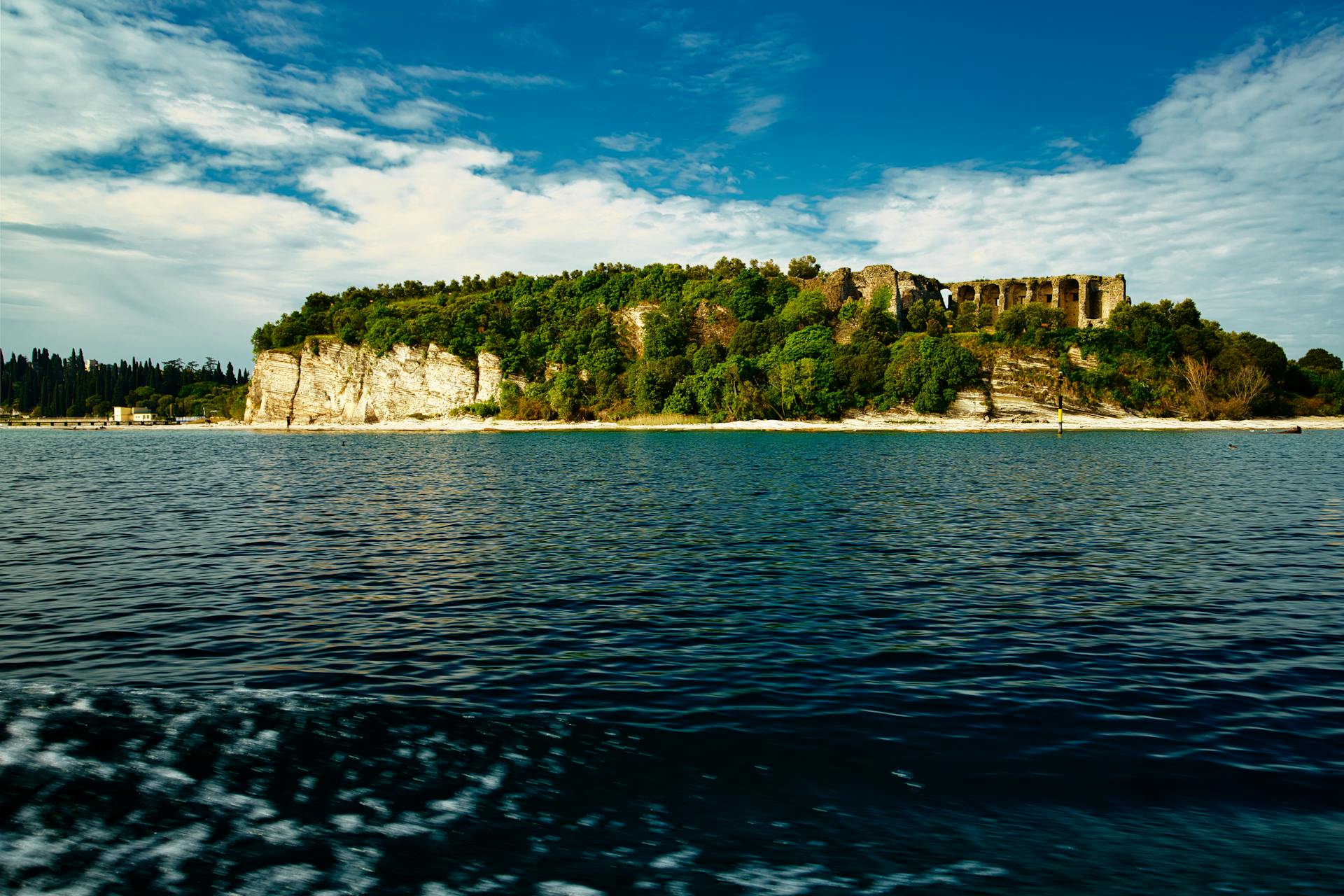 Beautiful island with ruins surrounded by sea, embodying a tropical and exotic vacation destination.