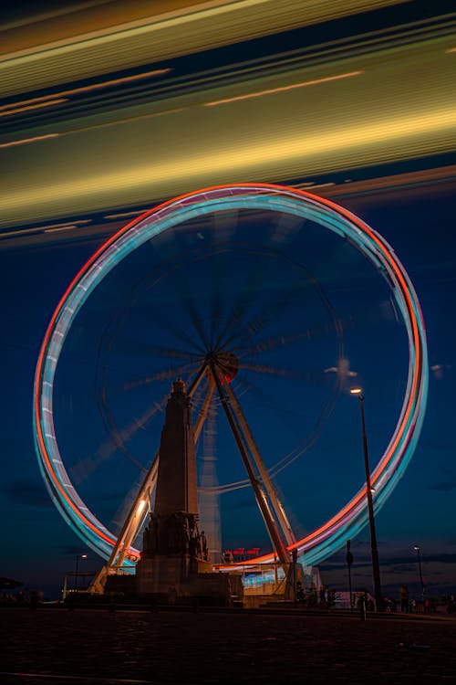 Spinning Ferris Wheel at Night