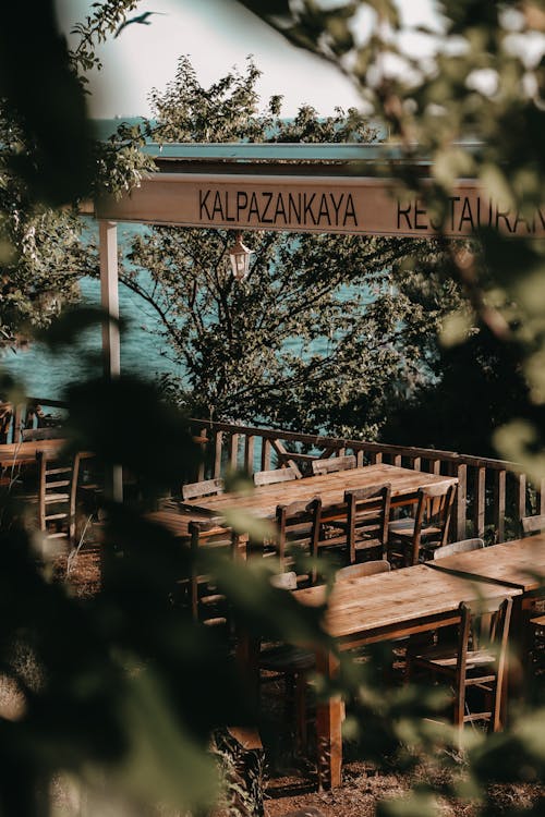 Chairs and Tables on Terrace of Restaurant Near Sea