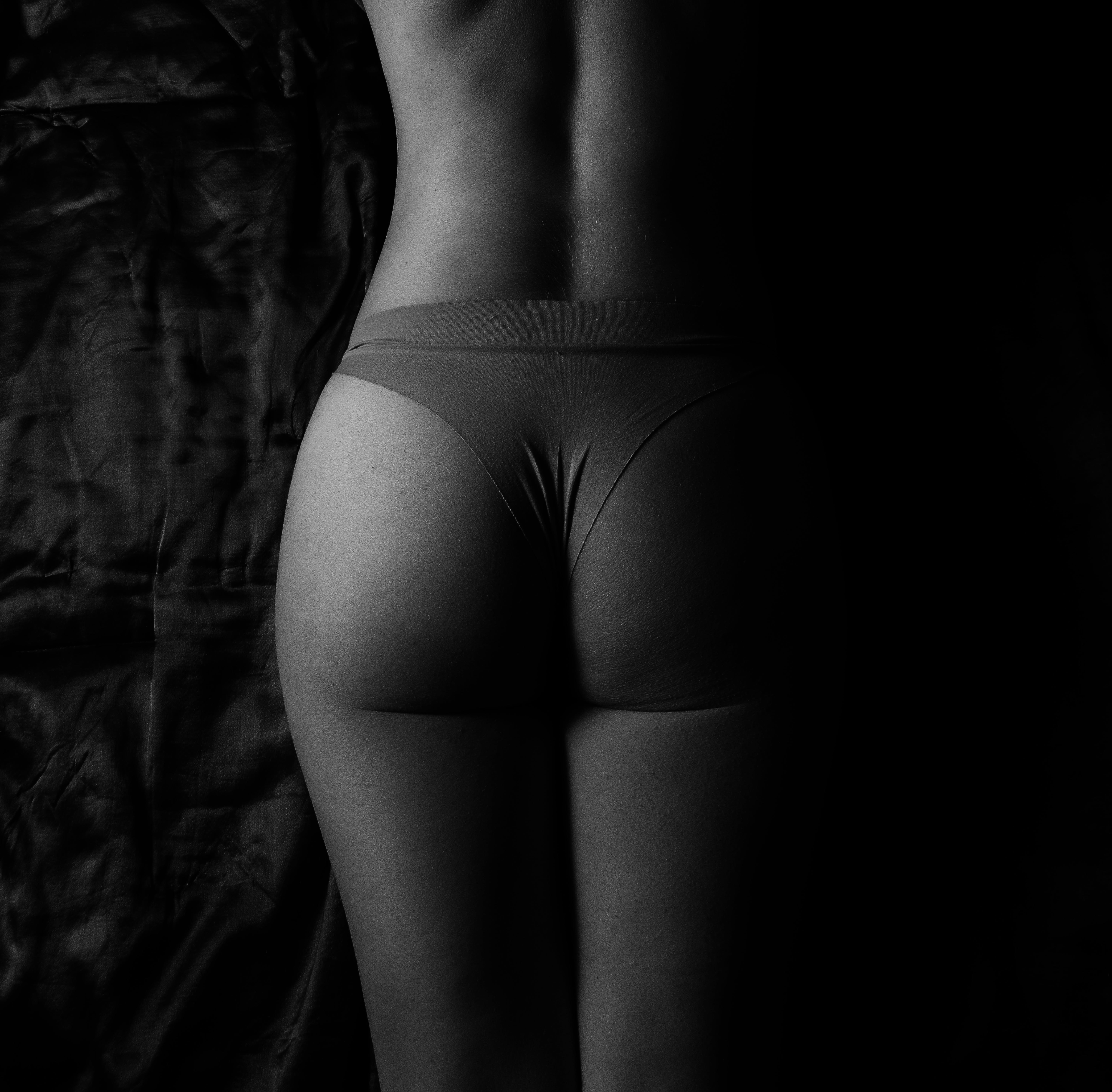 Female Ass In Black Panties On A White Background Stock Photo