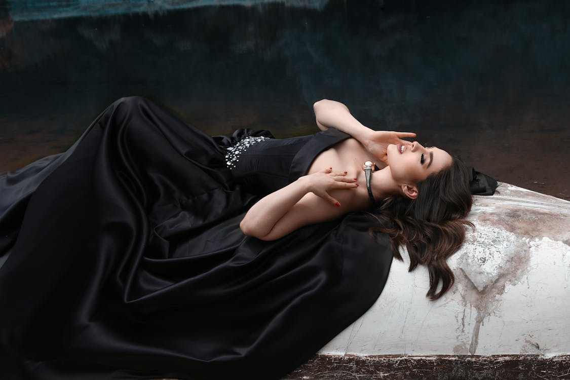 DSC02252 - Woman in Black Dress Laying on Rock near Golden…