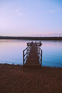 Wooden pier at sunrise — photo by Caio Mantovani on Pexels
