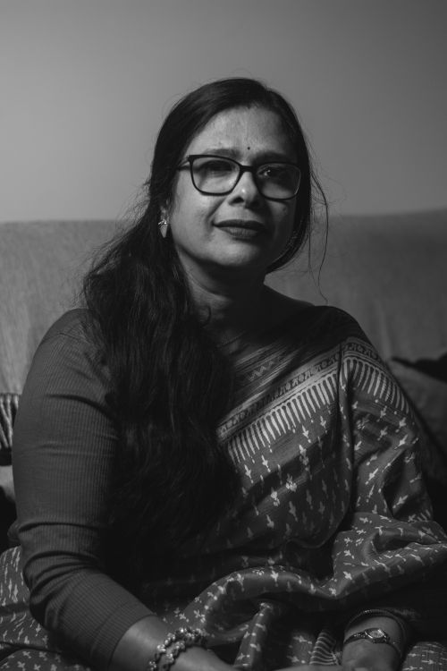 Free Elegant black and white portrait of a woman in traditional saree indoors. Stock Photo