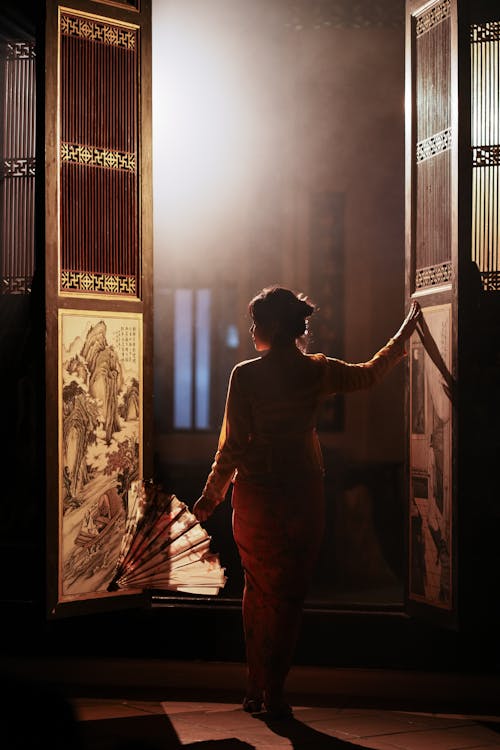 Light over Woman Standing and Posing in Doorway