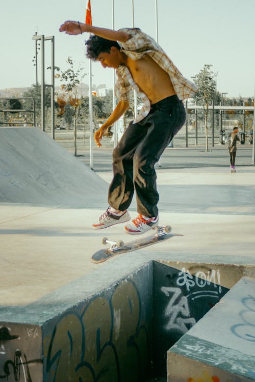 Man Skateboarding in Skatepark