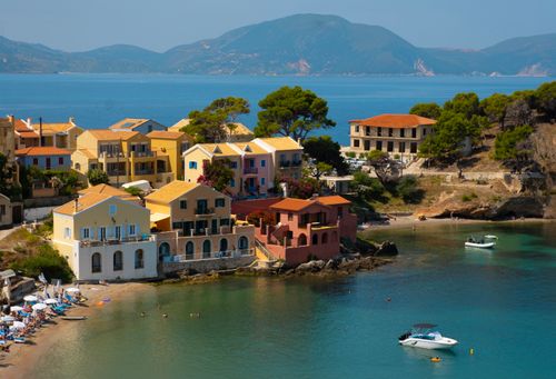 Free Idyllic coastal village in Kefalos, Greece with colorful houses by the sea. Stock Photo