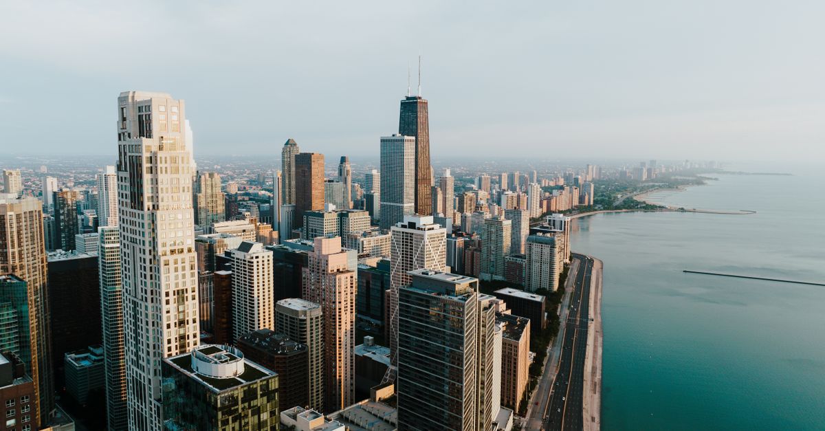 Stunning aerial view of the Chicago skyline along Lake Michigan, showcasing tall skyscrapers and beautiful skyline.