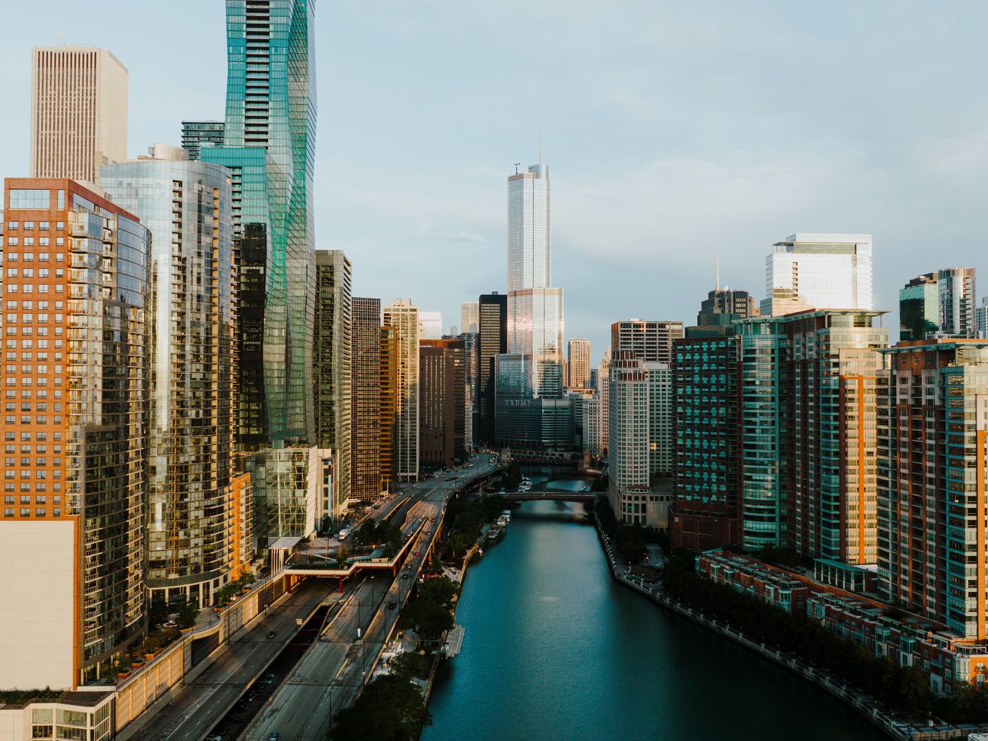 Chicago skyscrapers reflected in the river at sunset