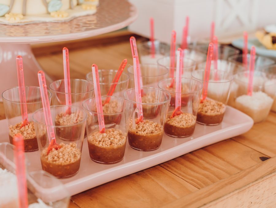 Assorted dessert cups arranged on a tray ready for an event