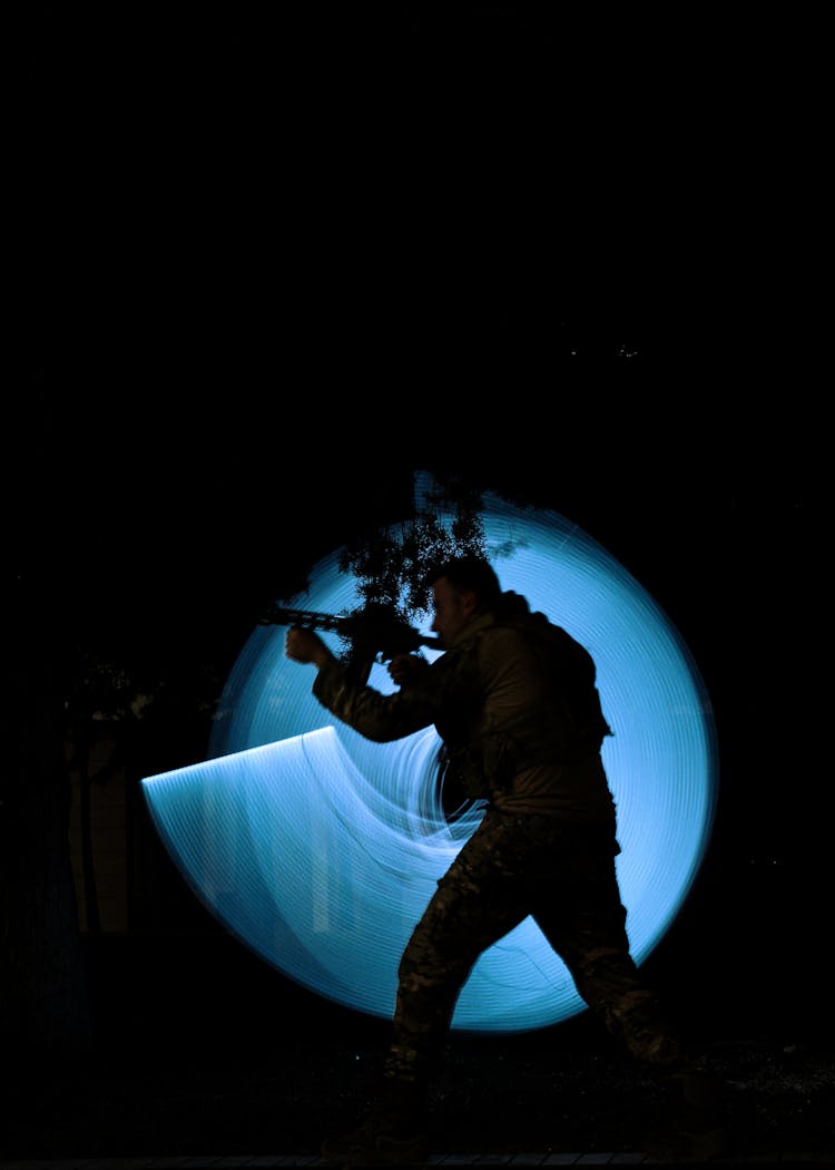 Silhouette Of A Shooting Man