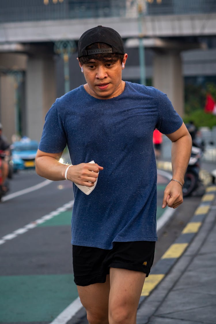 Man Jogging Along Street