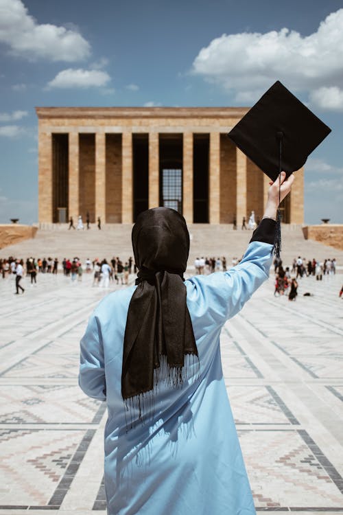 Graduate Standing with Academic Hat in Raised Arm at Anitkabir