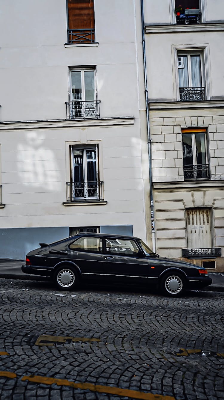 Black Saab 900 Car Parked On A Sloped Street