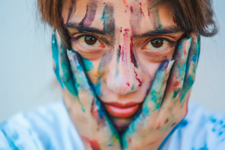 Girl Holding Her Face 