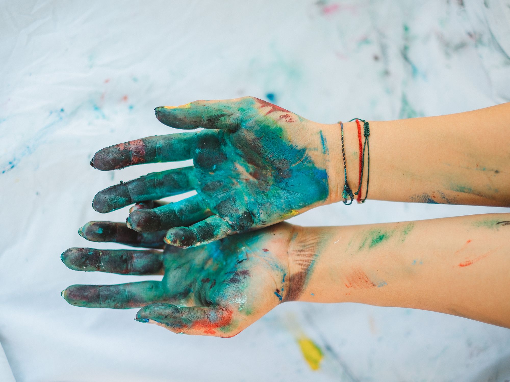 Painters & Decorators in St Helier, London — professional decorator painting a wall with a roller