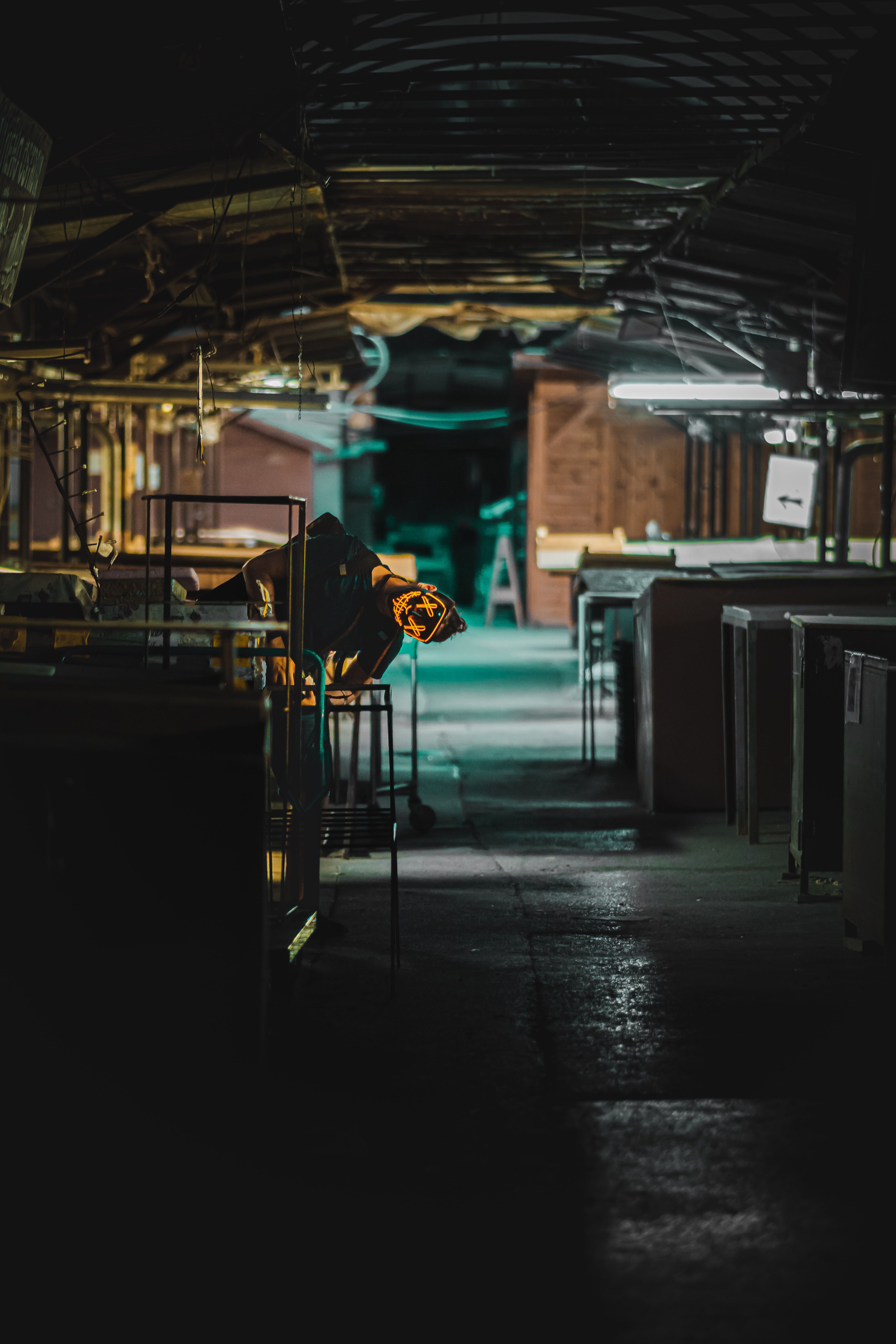 Lone worker in dim tunnel