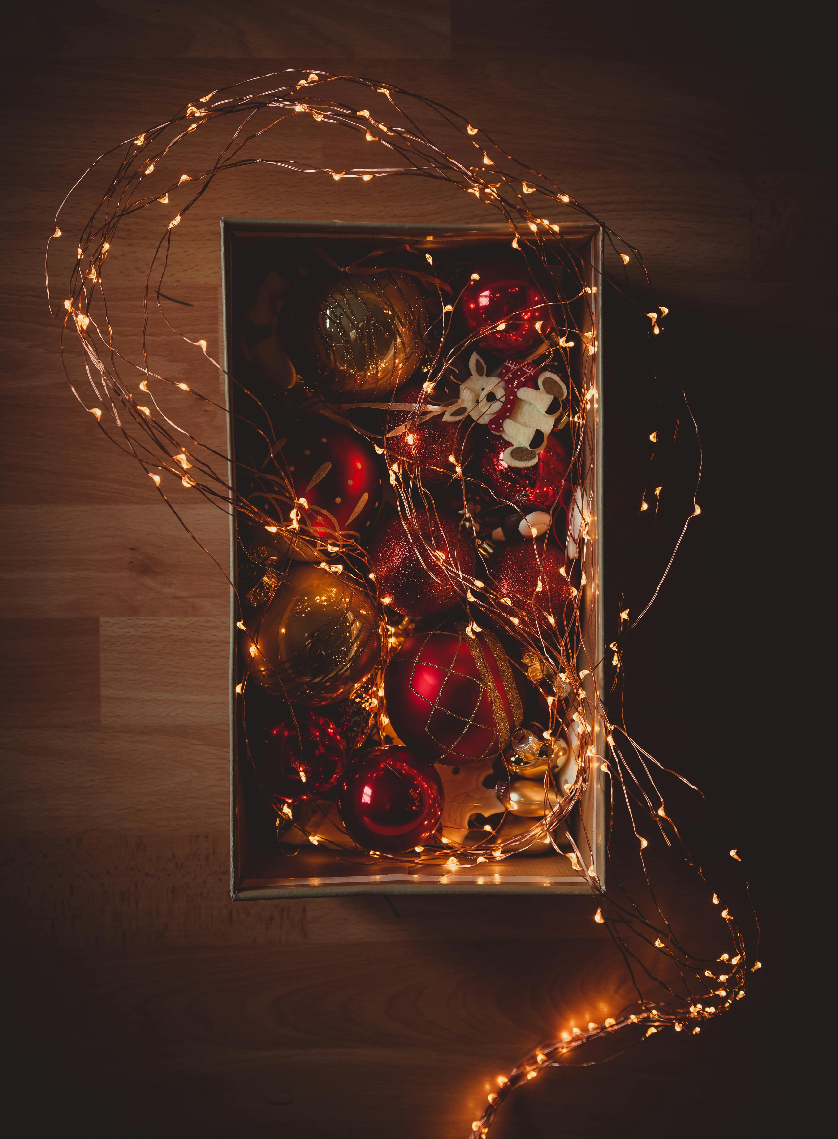 lighted string lights and baubles inside box