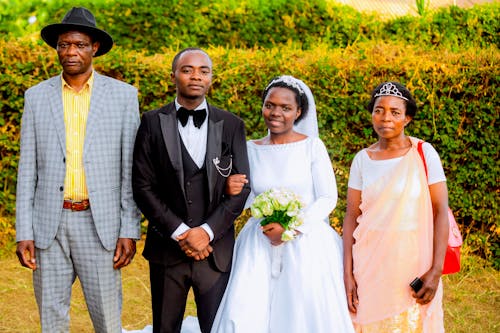 Bride and Groom Posing with Parents 