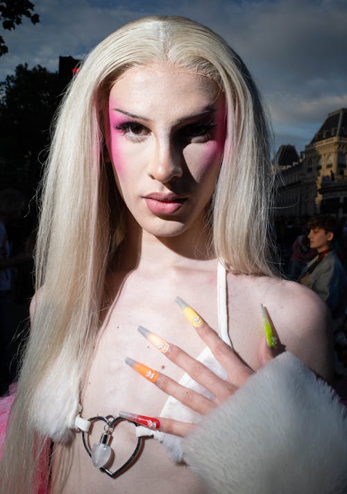 Person with Long Multi Colored Nail Tips