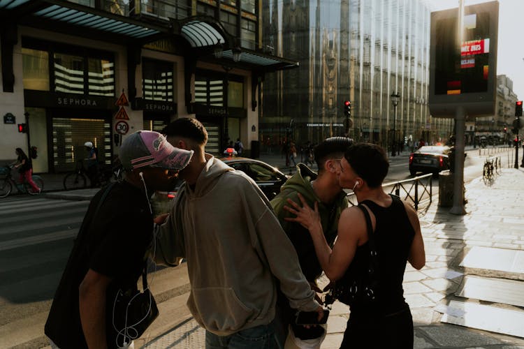 Friends Saying Hello On Street