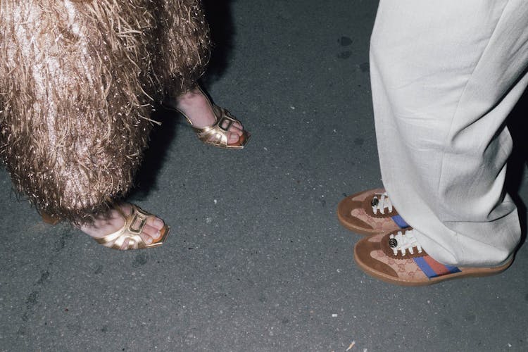 Legs In Shoes On Ground