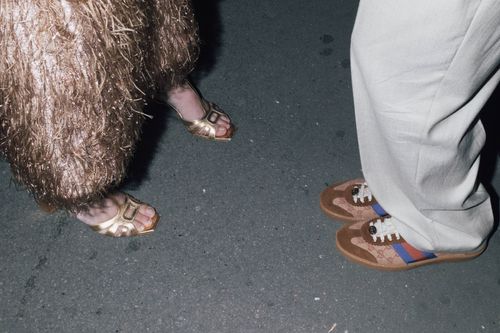 Free Close-up of fashionable shoes on a city street at night. Stock Photo