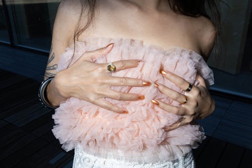 Woman Holding Hands on Breast