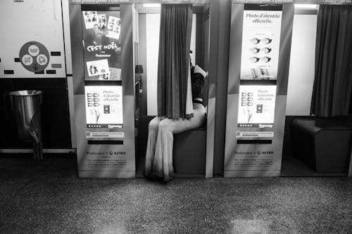 Free Woman Sitting in a Photo Booth  Stock Photo