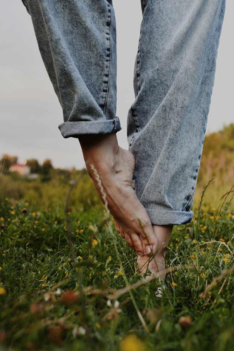 Legs Of Barefoot Person In Yoga Pose