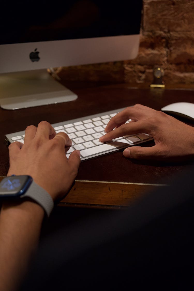 Person Touching Computer Keyboard