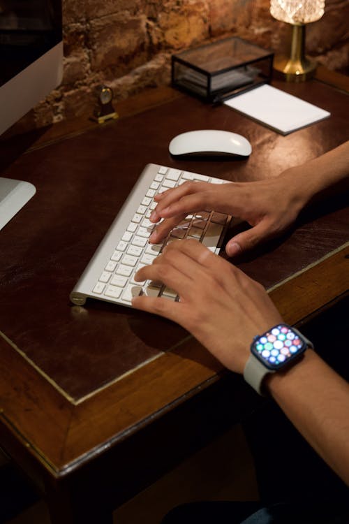 Hands Typing on Keyboard