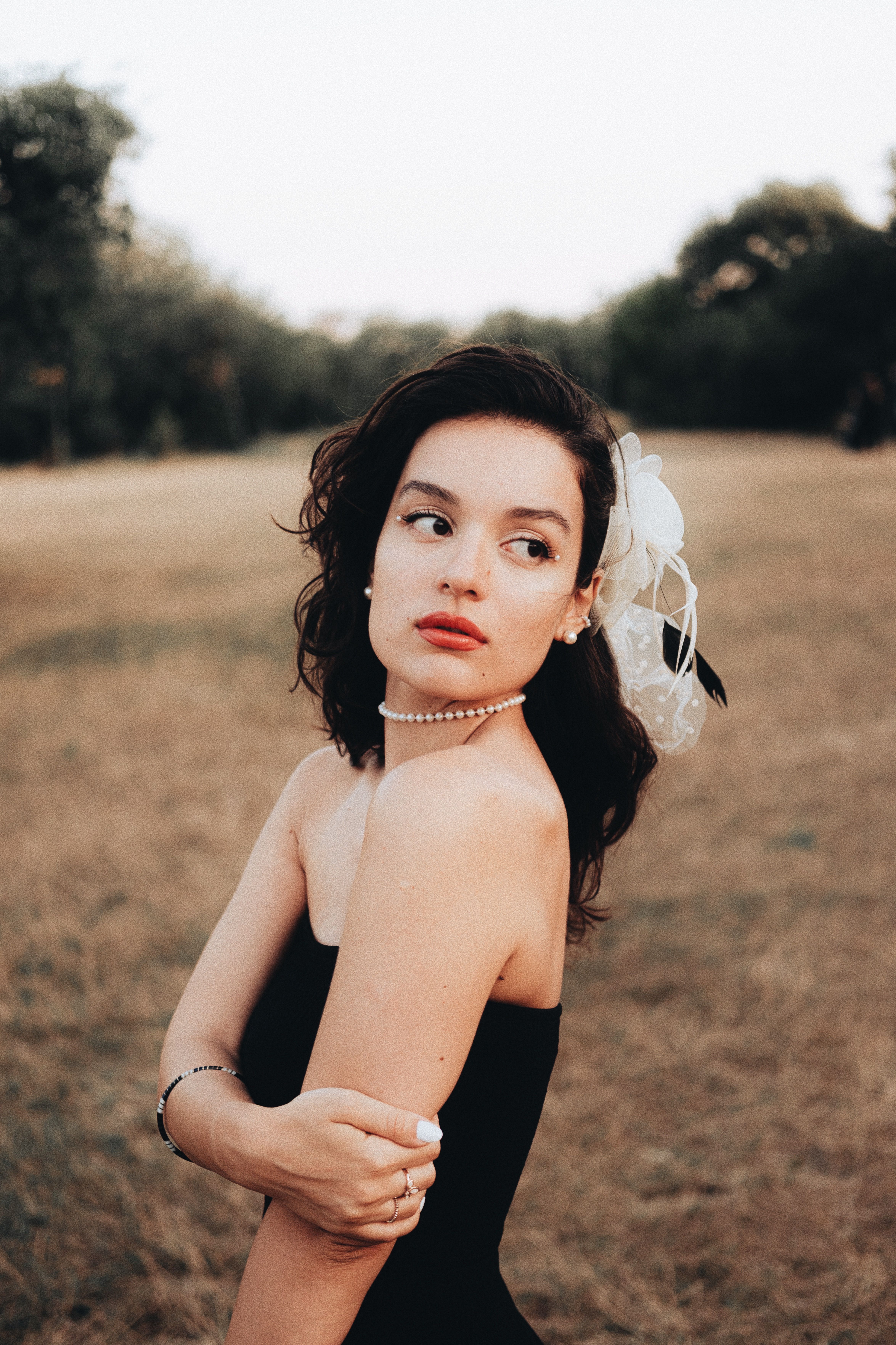 Beautiful Brunette Woman Posing in Black Bandeau Dress · Free Stock Photo