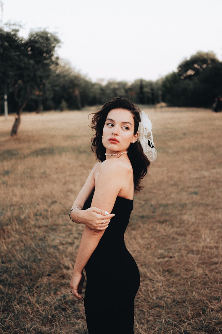 Young Beautiful Woman Posing In Black Bandeau Dress