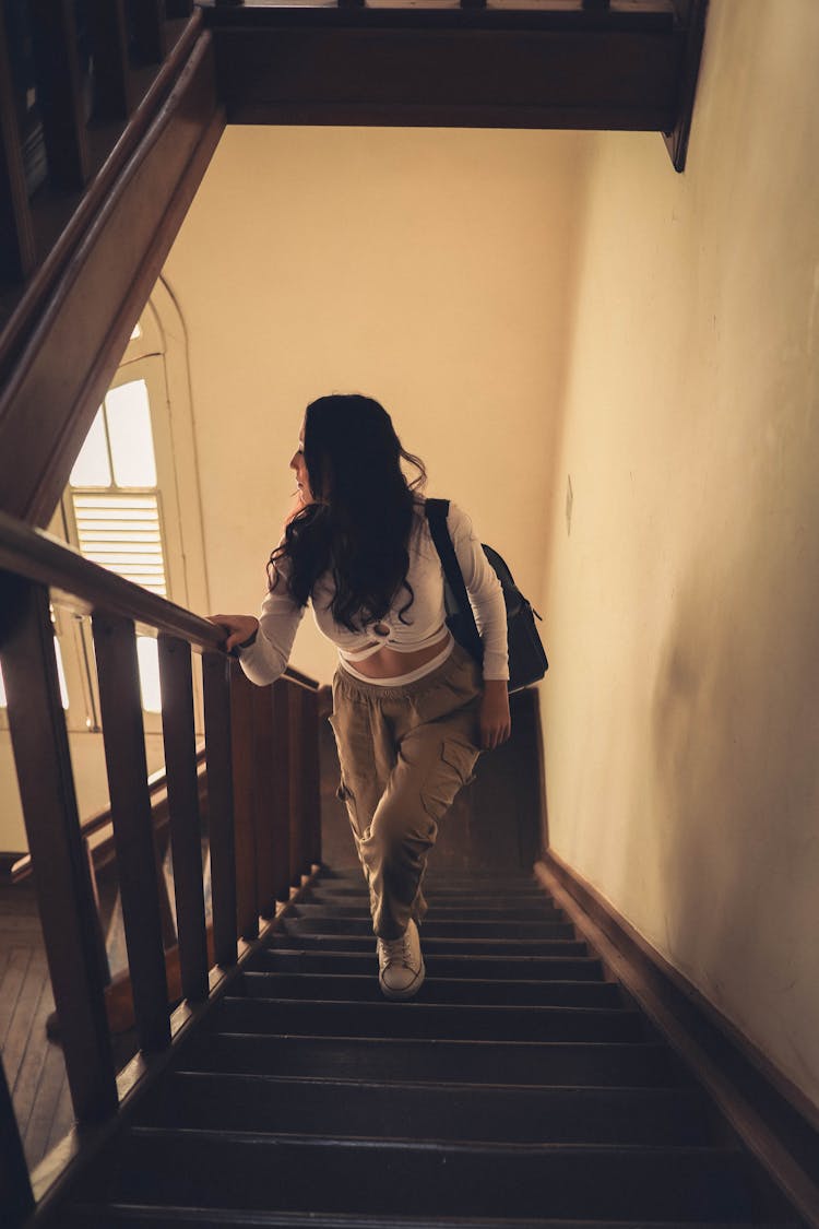 Woman Walking Upstairs