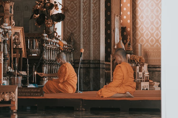 Monks Praying In A Temple