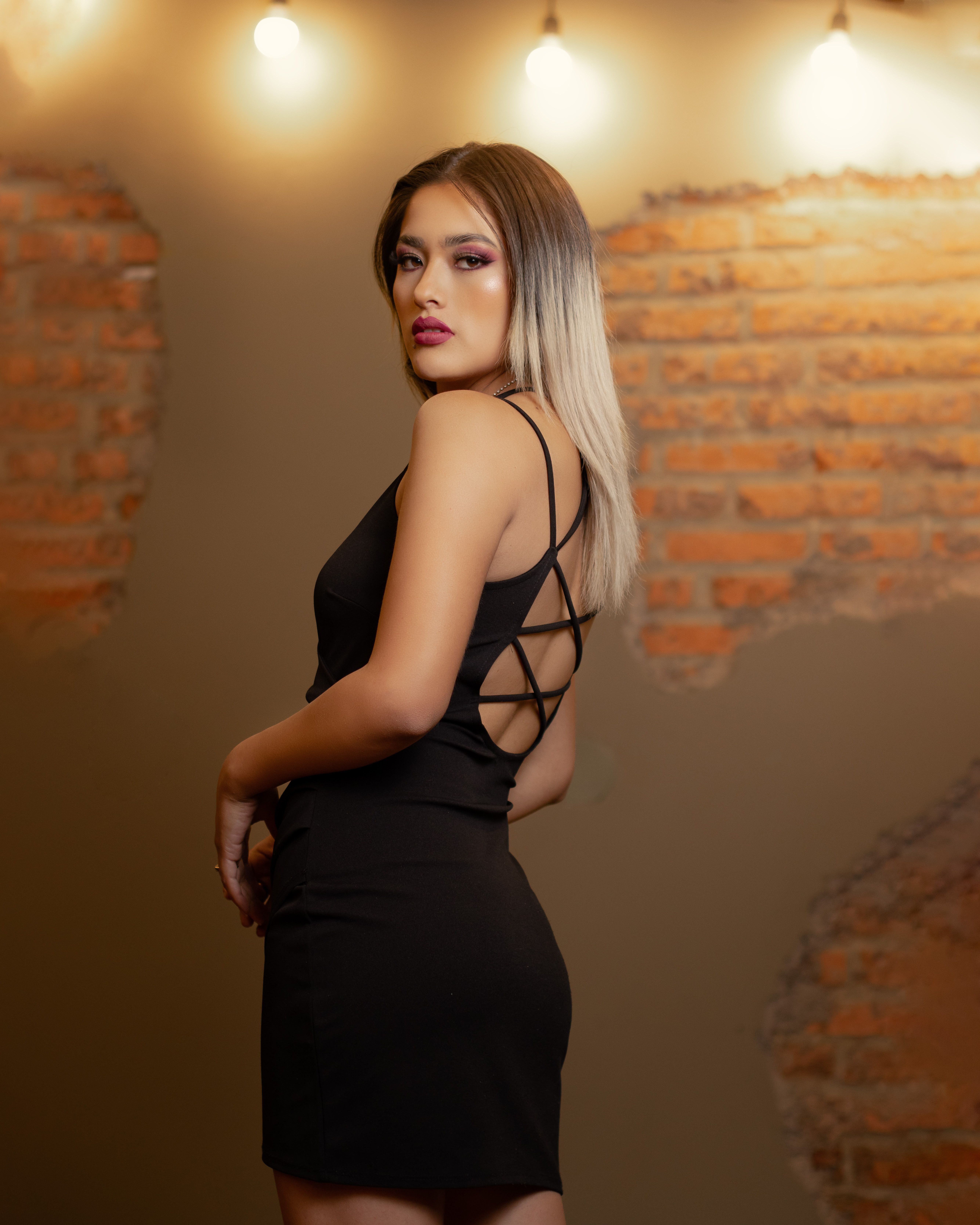Woman Posing in a Black Dress · Free Stock Photo