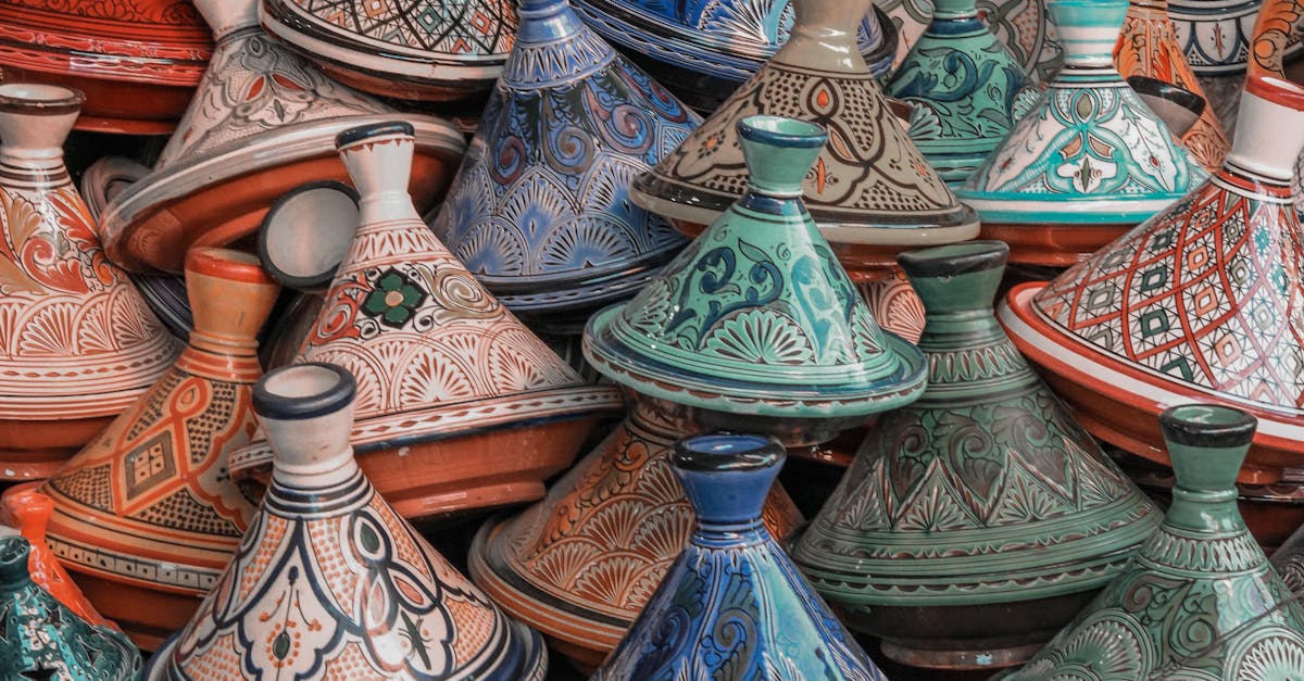 Colorful Moroccan tagine pots artfully stacked, showcasing traditional craftsmanship.