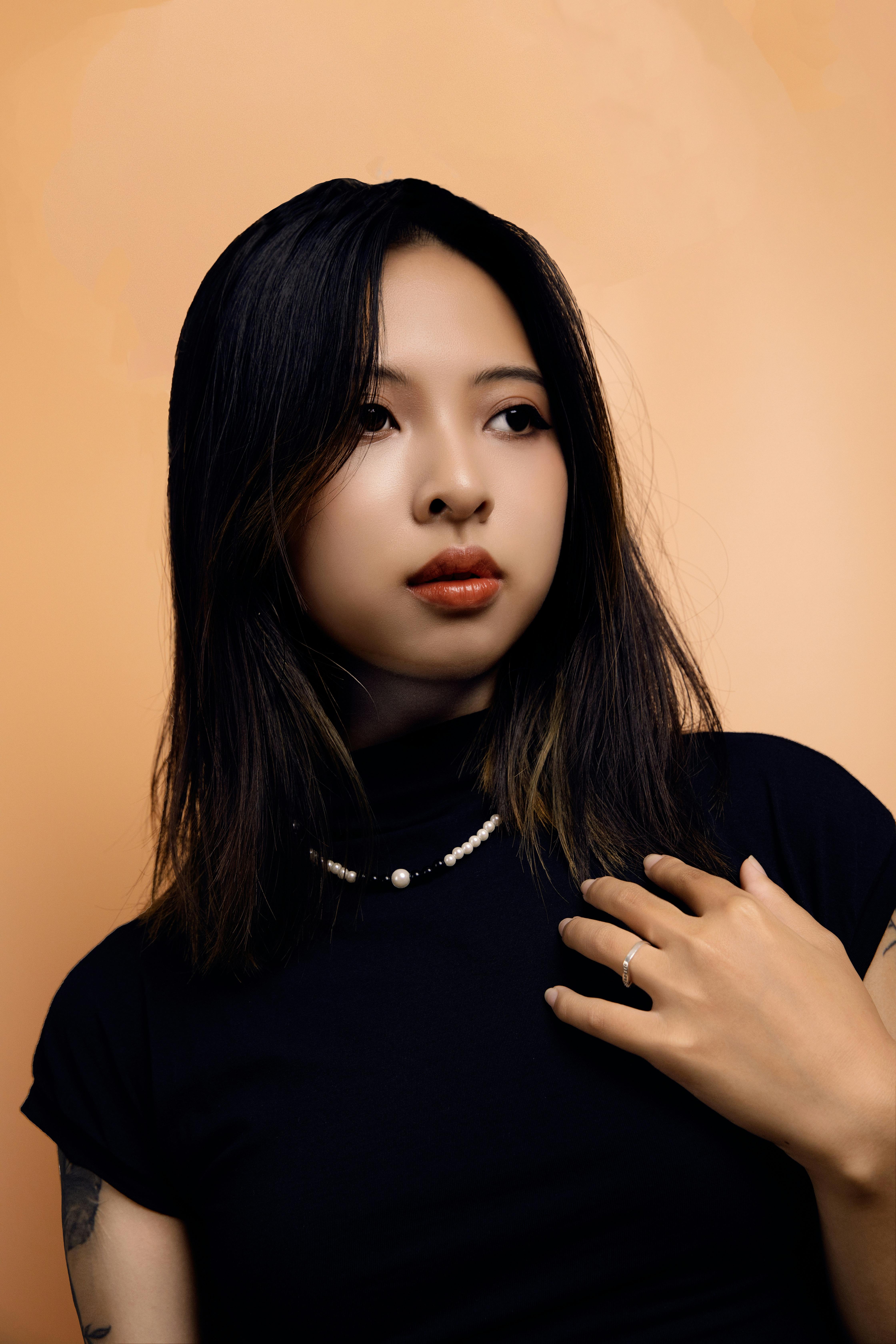 Woman in Green Tube Top Sitting on Tree Branches · Free Stock Photo