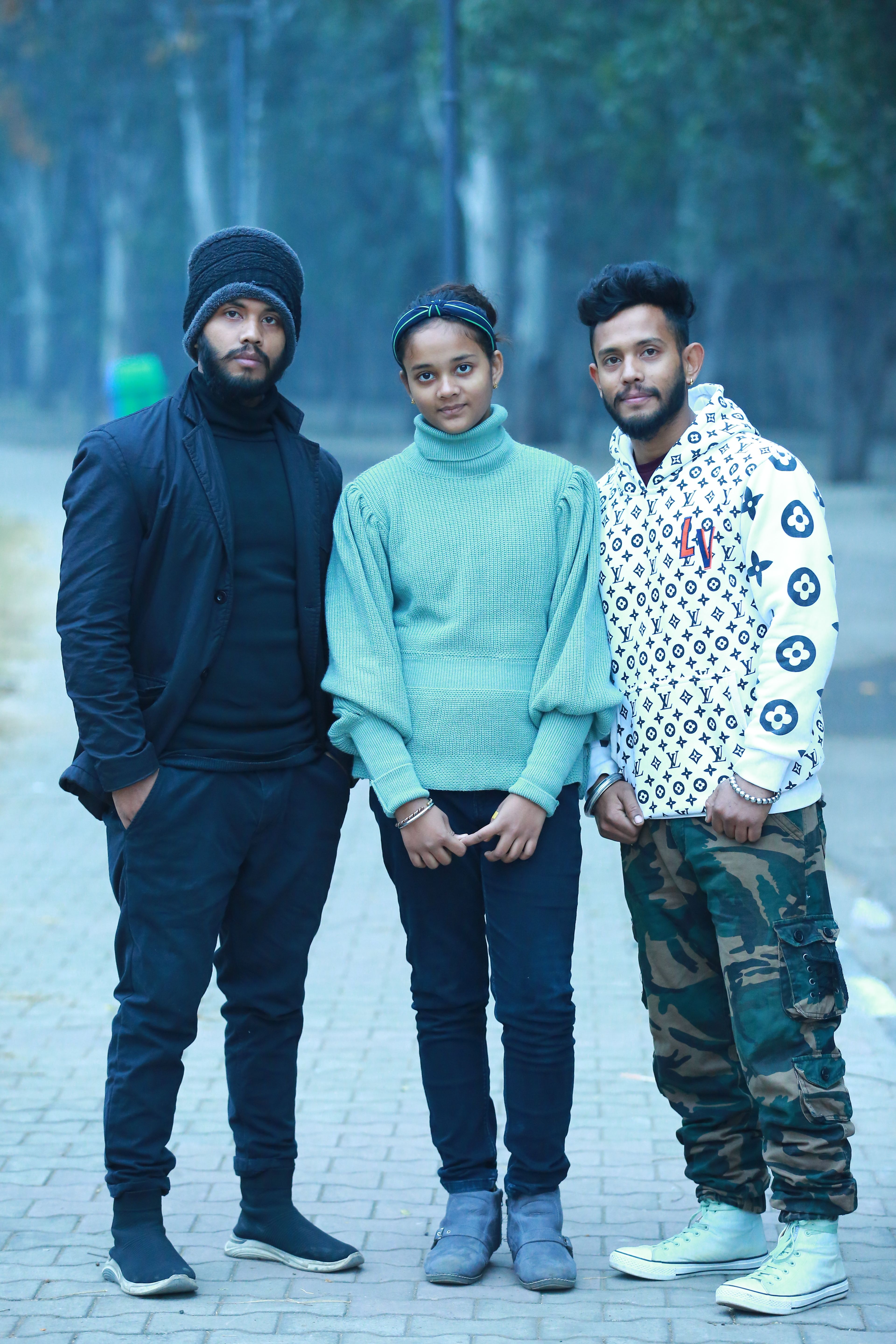 Group of young adults standing together on a misty street in Chandigarh, India.