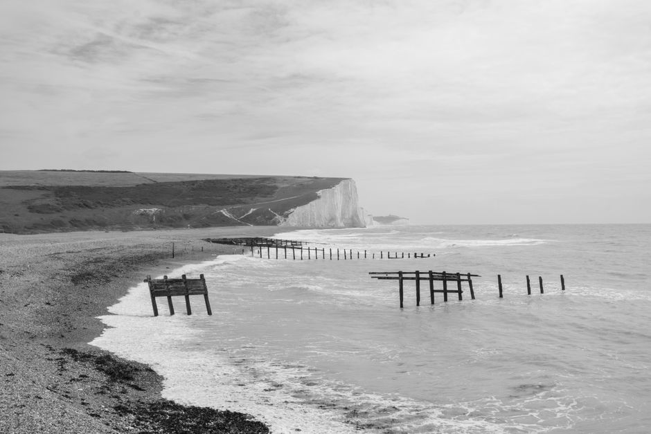 Monochrome seaside landscape showcasing the iconic cliffs at Cuckmere Haven.