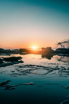 Beautiful coastline sunset in Sunshine Coast, Australia with tranquil water reflections.