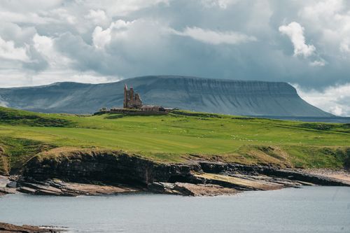 Free Scenic view of Classiebawn Castle with dramatic cliffs and lush greenery in County Sligo, Ireland. Stock Photo