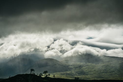 Landscape of Mountains under Heavy Clouds 