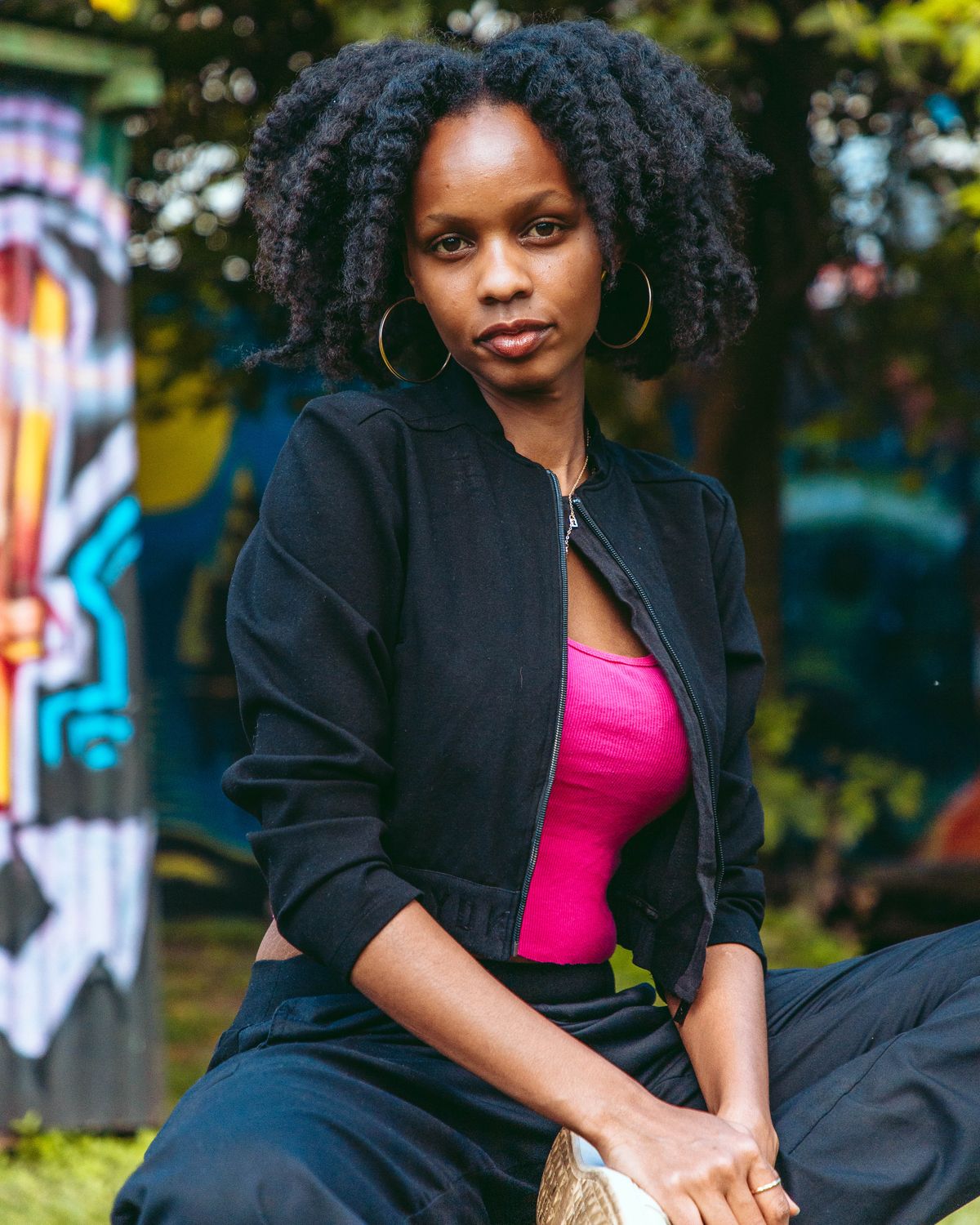 Portrait of a woman sitting outdoors in Nairobi