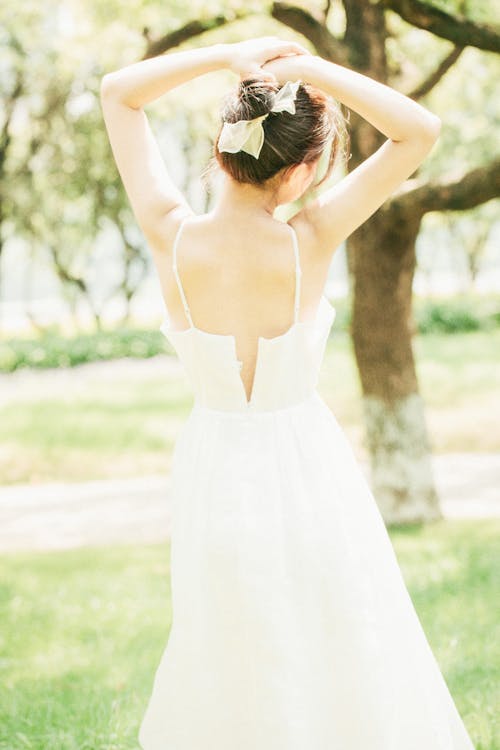 A Woman Wearing a White Dress 