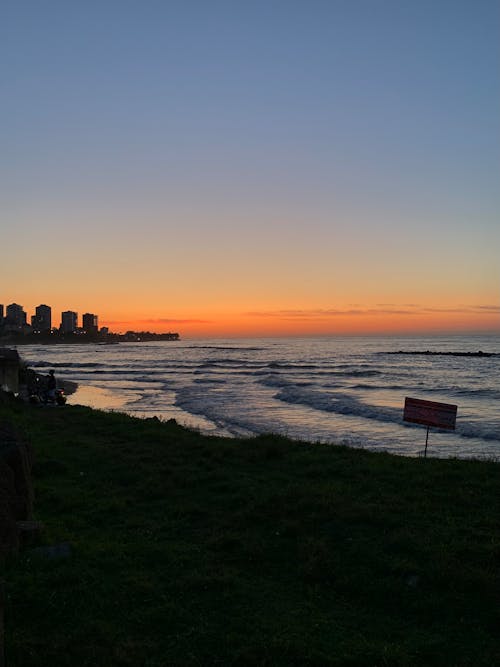 Sun Setting Over the Ocean Waves