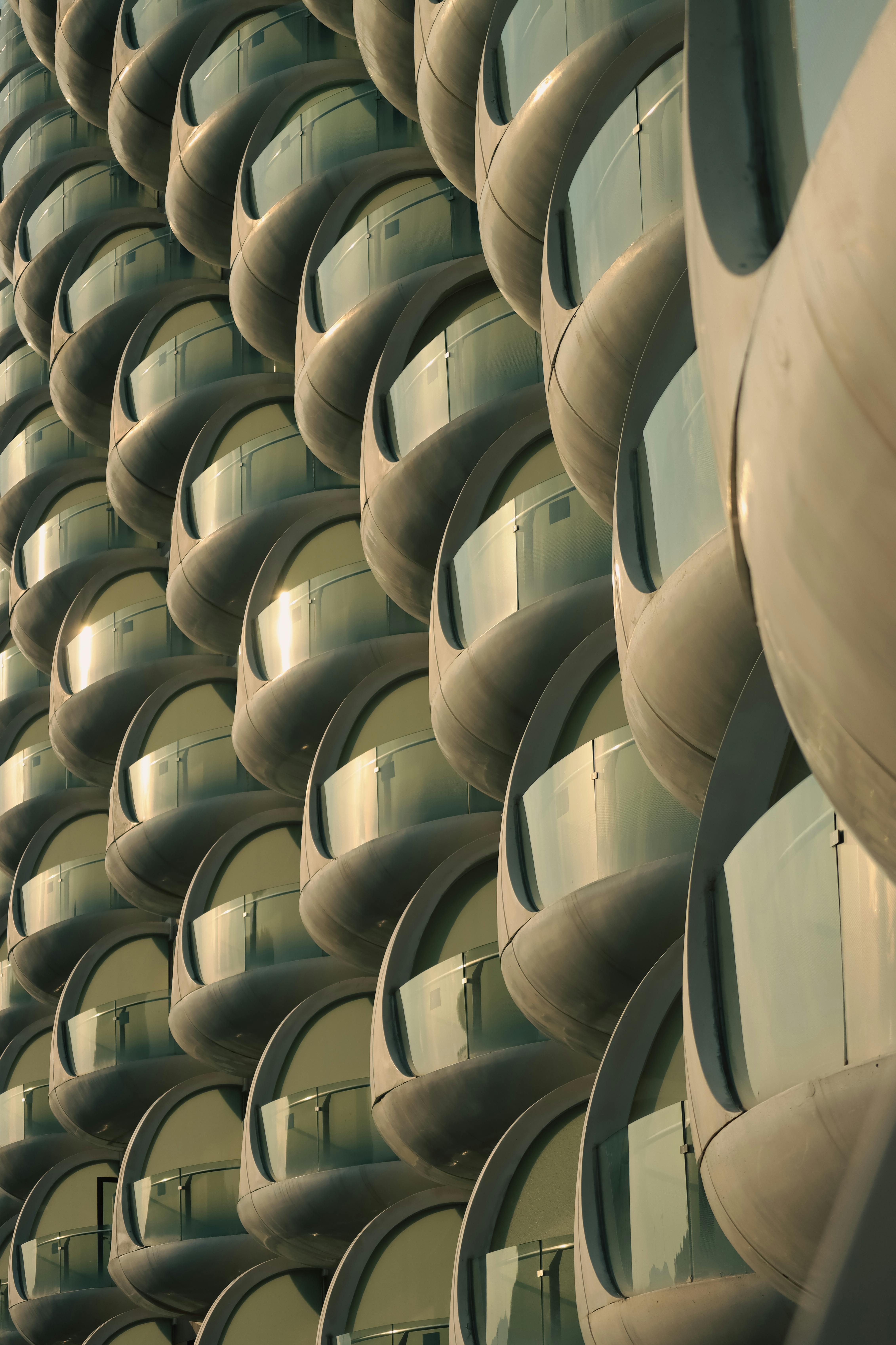 Close-up view of a contemporary building's futuristic rounded balconies, capturing urban architecture.