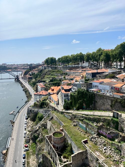 Free Aerial view of Porto's historic riverside architecture along the Douro River under a bright summer sky. Stock Photo